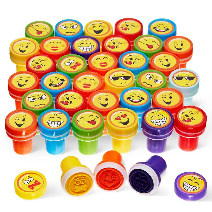 Assortment of colorful self inking emoji stamps.